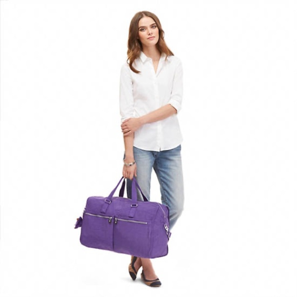 Kipling Itska Women’s Duffle Bag, Purple, with matching travel accessories.